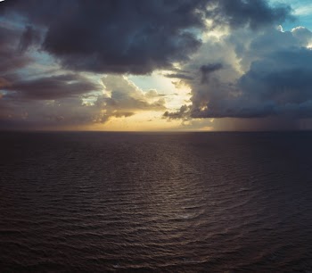 Calm Body of Water With Nimbus Clouds Background Photography