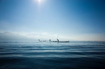 calm body water under blue sky