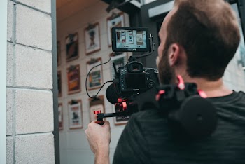 Camera Man About to Enter Open Door