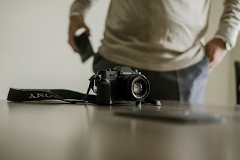 Camera on Table Near Man