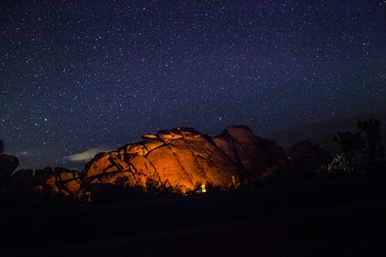 Camp Fire Beside Cave during Nighttime