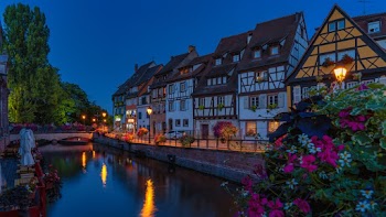 Canal Beside Houses Under Clear Sky
