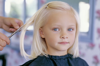 Candid Child Haircut in Salon