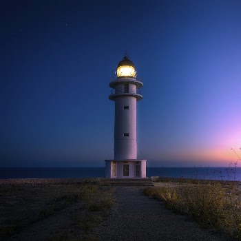 Cap de Barbaria lighthouse at sunset. | Free Photo - rawpixel