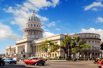 Capitolio building Havana, Cuba with vintage old american cars