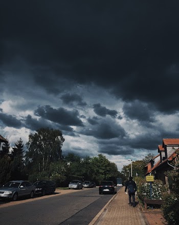 Car on Road Under Clouy Sky