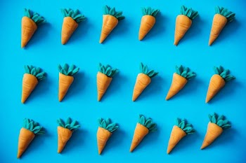 carrot toys on blue surface