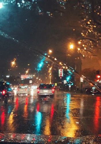 Cars Driving on Asphalt Road during Rainy Night