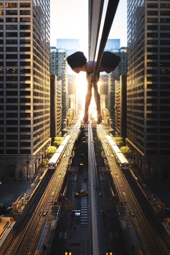 Cars on Road Between High Rise Buildings