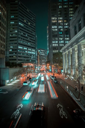 Cars on Road in City during Night Time
