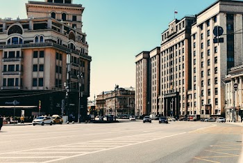 Cars On Road Near Buildings