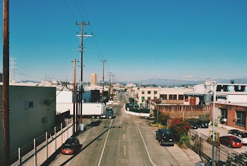 Cars on Road Near Buildings