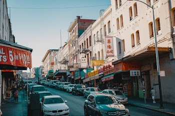 Cars on Road Near Buildings
