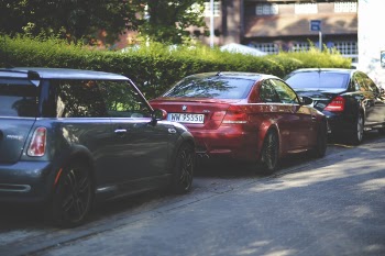 Cars parked along way
