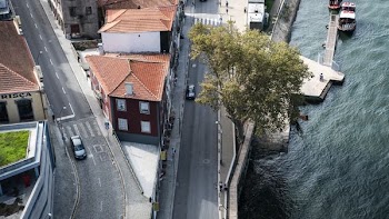 cars passing through splitting road near water
