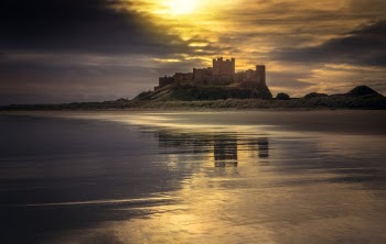 Castle Near Body of Water Under Golden Hour