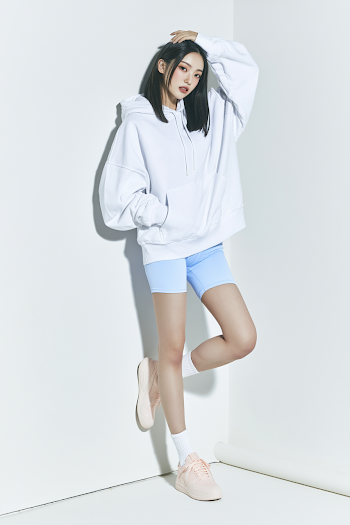 Casual Fashion Portrait of Young East Asian Woman in Oversized Hoodie