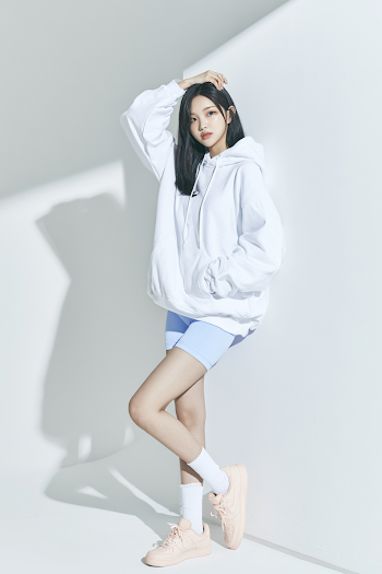 Casual Fashion Portrait of Young Woman in Minimal Sportswear