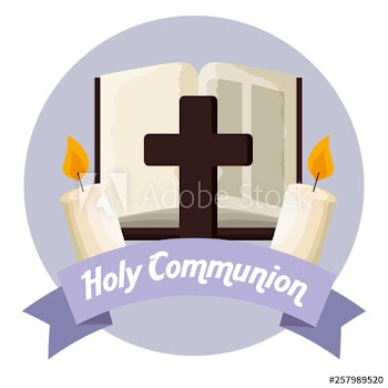 catholic bible with cross and candles to first communion