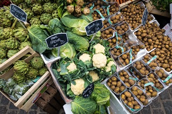 Cauliflower, potatoes and other vegetables at a market 