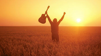Celebration in a Golden Wheat Field at Sunset