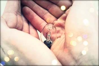 Centered Clear Bulb on Human Hand