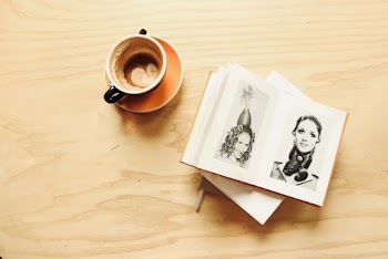Ceramic Cup Besides Photo Album