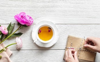ceramic cup filled with orange liquid