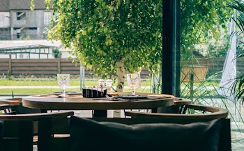 Chairs Beside Table With Drinking Glasses