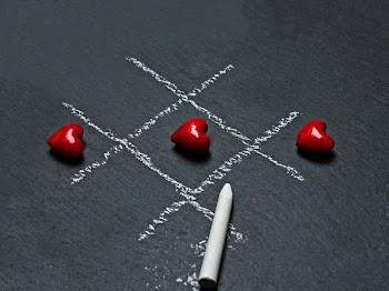 Chalk Drawn Tic-tac-toe With Three Lined-up Heart