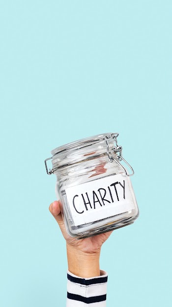 Charity money jar for donation campaign | Free stock photo | High Resolution image