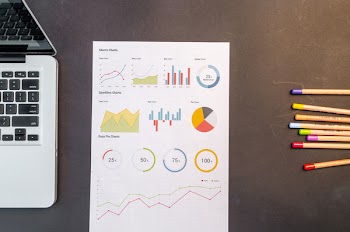 Charts On Black Wooden Table