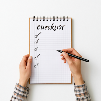 Checklist on Notepad with Pen