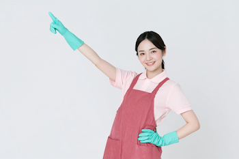 Cheerful Asian Woman Cleaning Worker in a Studio