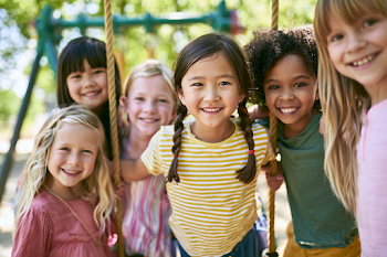 Cheerful Children Playing Together in a Sunny Park