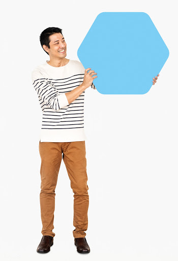 Cheerful man showing a blank blue hexagon boa.. | Free stock psd mockup - 491055