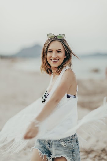 Cheerful woman at the beach, | Free Photo - rawpixel
