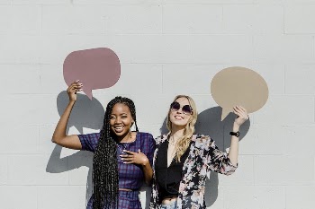 Cheerful women showing blank speech | Free PSD Mockup - rawpixel