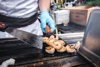 Chef grilling shrimps 