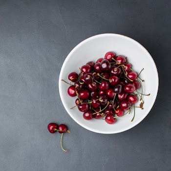 Cherries on White Ceramic Bowl
