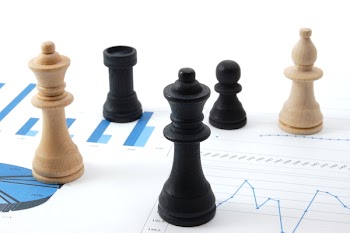 chess man over business chart admonish to strategic behavior