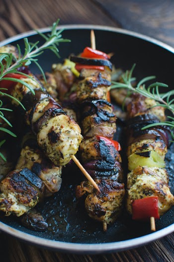 Chicken skewers on a wooden background 