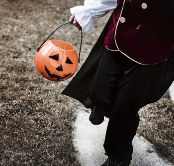 Child Holding Halloween Candy Basket