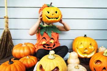 Child Holding Jack-'o-lantern