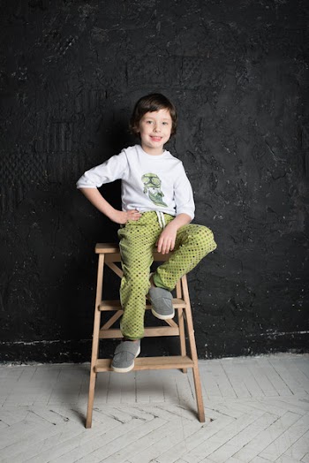 Child Sitting on Step Stool