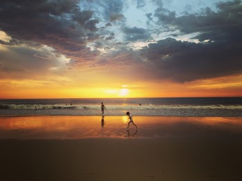 Child Standing on Seashore