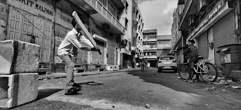Children Playing Cricket at the Alley