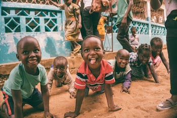 Children Sitting on Ground