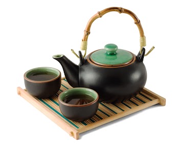 Chinese brown teapot and teacups on the wooden trivet isolated on white