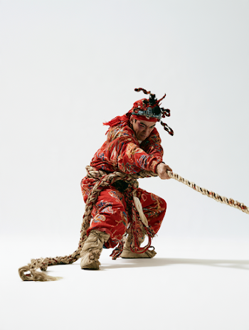 Chinese Deity Pulling a Rope in Traditional Attire